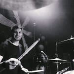 Session Drummer on stage smiling at camera