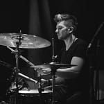 Black and white picture of Pop Rock Session Drummer performing on stage
